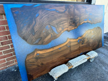 Live edge wood with epoxy resin dining table in modern home