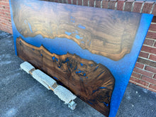 Live edge wood with epoxy resin dining table in modern home