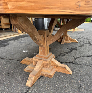 Farmhouse-style dining table with trestle base in reclaimed teak wood