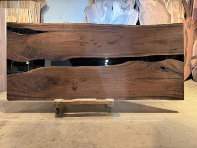 Live edge epoxy resin table top made from natural walnut wood with river design for modern rustic furniture