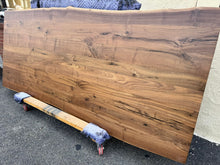 Live edge walnut wood table top measuring 93x39 inches with natural grain and rich brown tones