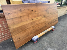 Live edge walnut wood table top measuring 93x39 inches with natural grain and rich brown tones
