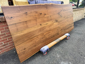Live edge walnut wood table top measuring 93x39 inches with natural grain and rich brown tones