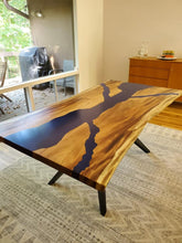 Live edge acacia wood dining table with river blue epoxy