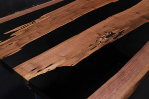 Live edge epoxy resin table top made from natural walnut wood with river design for modern rustic furniture