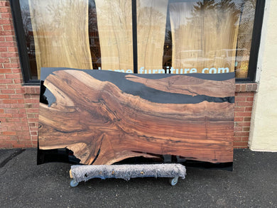 Live edge wood with epoxy resin dining table in modern home