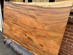 Handcrafted live edge wood dining table made from solid walnut, featuring natural wood grain and rustic modern design – perfect for farmhouse or contemporary dining rooms.