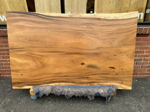 Handcrafted live edge wood dining table made from solid walnut, featuring natural wood grain and rustic modern design – perfect for farmhouse or contemporary dining rooms.