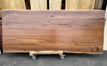 Handcrafted live edge wood dining table made from solid walnut, featuring natural wood grain and rustic modern design – perfect for farmhouse or contemporary dining rooms.