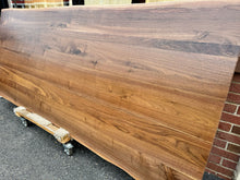 Handcrafted live edge wood dining table made from solid walnut, featuring natural wood grain and rustic modern design – perfect for farmhouse or contemporary dining rooms.