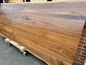 Handcrafted live edge wood dining table made from solid walnut, featuring natural wood grain and rustic modern design – perfect for farmhouse or contemporary dining rooms.
