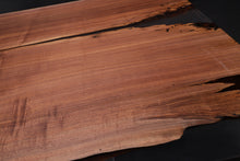 Live edge wood with epoxy resin dining table in modern home