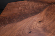 Live edge wood with epoxy resin dining table in modern home