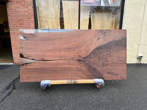 Live edge wood with epoxy resin dining table in modern home