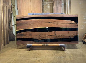 Live edge epoxy resin table top made from natural walnut wood with river design for modern rustic furniture