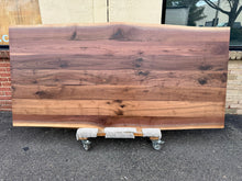 Handcrafted live edge acacia wood dining table top in Alexandria VA showroom