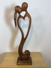 Kissing couple abstract wood sculpture
