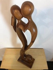 Kissing couple abstract wood sculpture