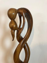 Kissing couple abstract wood floor sculpture