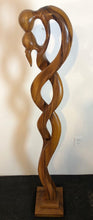 Kissing couple abstract wood floor sculpture