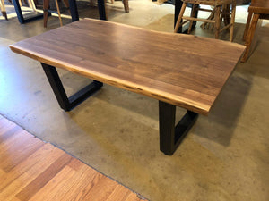 Live edge walnut wood coffee table with trapezoid metal legs
