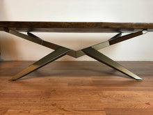 Live edge walnut coffee table with metal base in brass finish