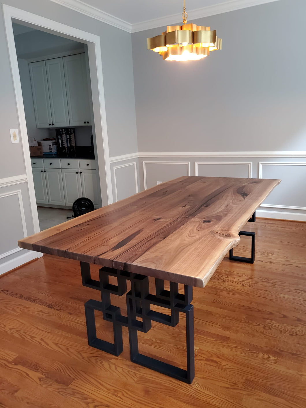 Live edge walnut dining table with mesh base