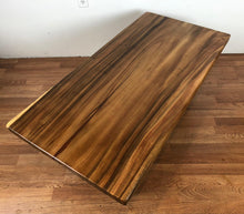 Acacia coffee table with trapezoid metal legs