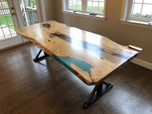 Live edge wood slab table with epoxy