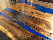 Live edge dining table with river epoxy