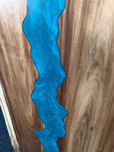 Live edge wood slab dining table with epoxy