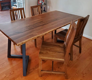 Live edge walnut wood dining table and teak wood chairs